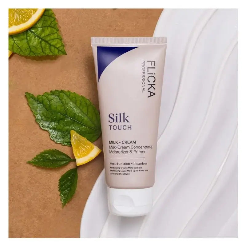 Flicka Silk Touch milk cream tube with lemon slices and leaves on a brown background