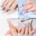 Four different designs of decorative nails on a plain background