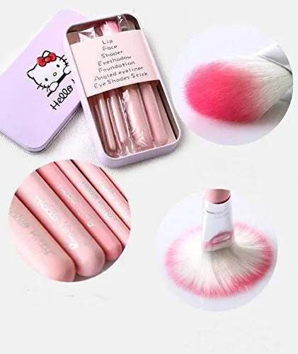Set of pink makeup brushes with a Hello Kitty-themed tin on a white background