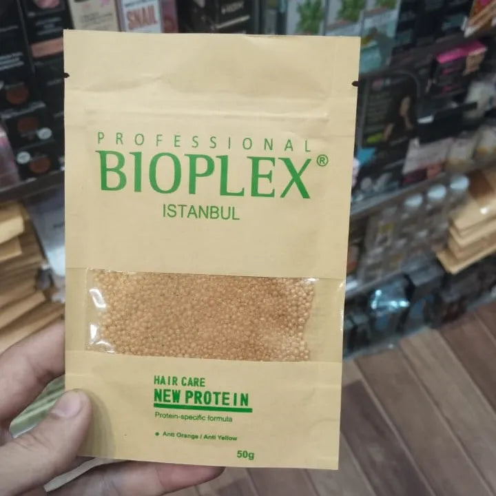 Bioplex Istanbul hair care product package held by a hand in a store setting